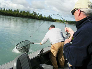 Two fisherman fishing on the Kenai River in Alaska